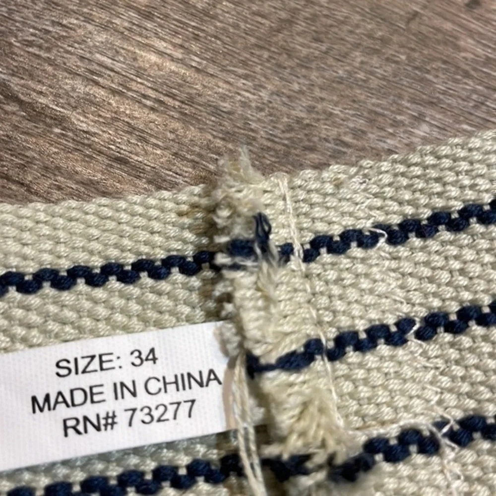 Natural fiber handcrafted loom woven tan and navy belt fits up to 38 inches